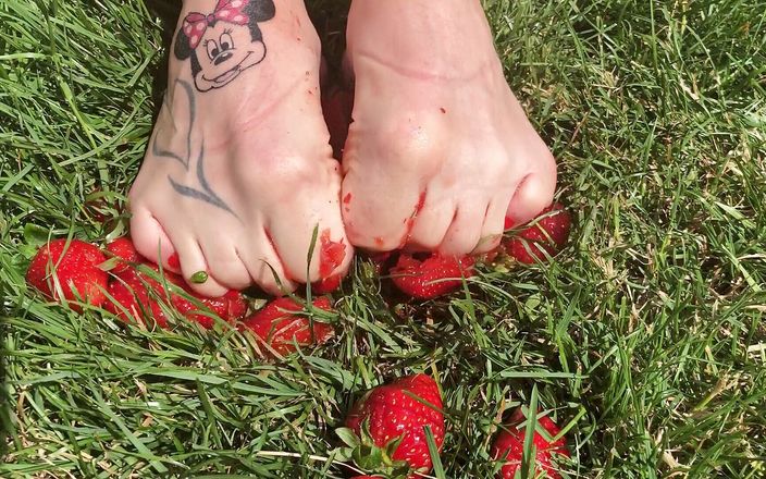 Euro Models: Feet crushing strawberries close up