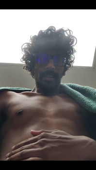 Masturbating