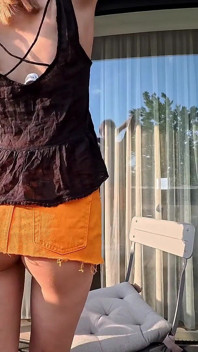 Hot Long Legs Sexy Beauty on the Balcony Flashes Her Panties Under Her Skirt Then Takes Underwear off to Show Tight Pussy