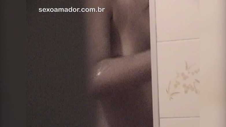 Amateurs videos: Amateur video of young brunette taking a shower with an...