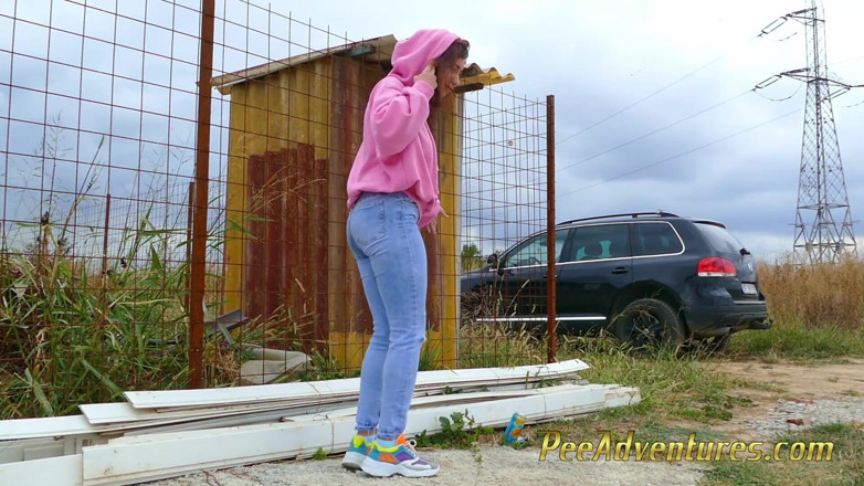 Pee Adventures: Girl with a hoodie pee trough her jeans