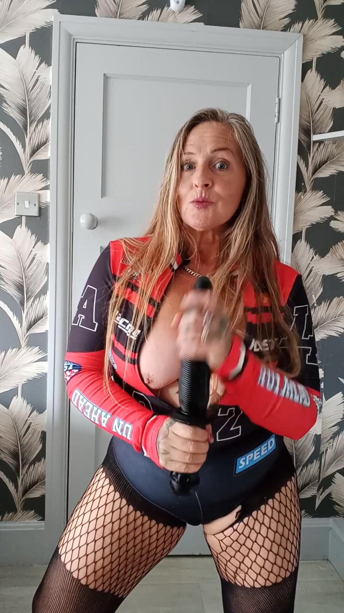 Kitty James: Red Moto Gp Top and Stockings with Fisting Toy