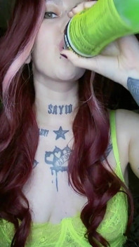 Sexy Alternative Redhead Drinking Soda and Burping