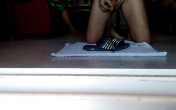 Sex hub male: John is peeing on the bathing slippers on the floor