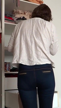 After Urinating, the Stepmother Puts on Very Tight Jeans, Revealing Her Panties