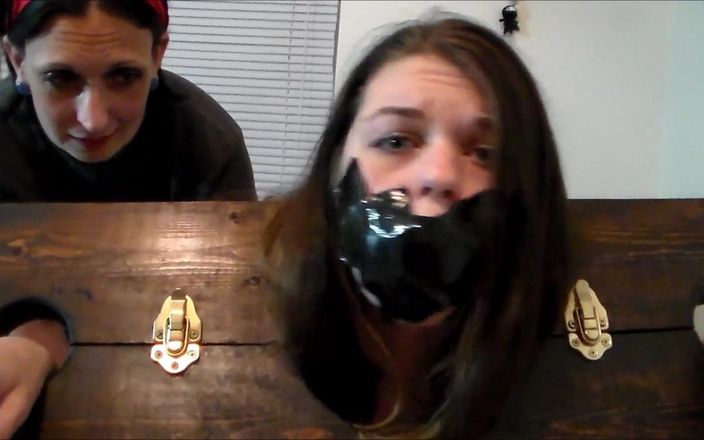 Selfgags classic: Thieving roommate locked in the stockade and gagged with her...