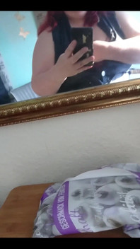 Showing off in a cool lab coat in front of the mirror