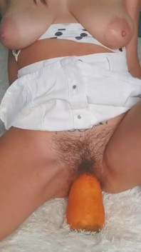 Giant carrot stretches tight pussy very wide
