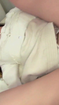 While the girl is busy with a message on the phone, the guy gives her pleasure with a vibrator