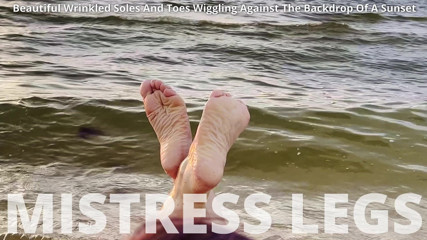 Mistress Legs: Beautiful Wrinkled Soles and Toes Wiggling Against the Backdrop of...