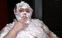 Ms Kitty Delgato: I lather myself down with shaving cream, covering my face,...