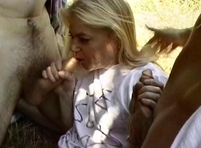 European Classics: Blonde teen sucks two big dicks outdoors
