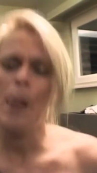 A very slutty couple with she blonde and busty gets caught on video fucking in the kitchen