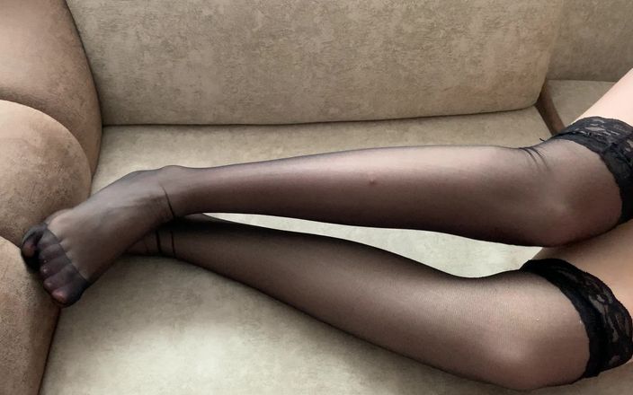 Gloria Gimson: Girl in Black Stockings Caresses Her Long Legs