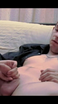A Dude in a Baseball Cap Undresses and Jerks off on the Couch