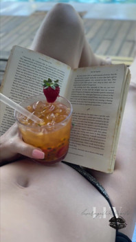 Reading by the Pool in a Bikini That Barely Counts as Spf