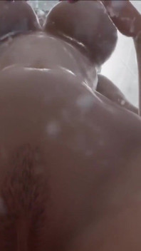 She plays with her pussy in her shower