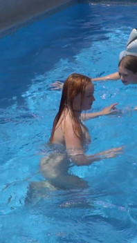Lesbian Girls Are Having Fun in a Pool with an Inflatable Shark