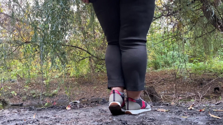 Elena: MILF dressed in pants pissing outdoors