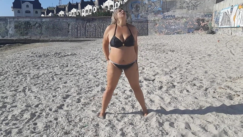 Sunny Loveli: Games in the sand on the beach. Touching big tits...