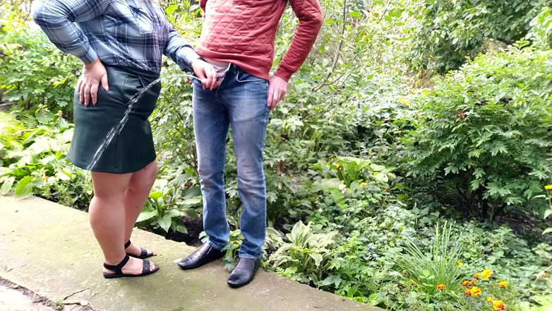 OurFetishLife: MILF gives golden shower after helping man pee outside