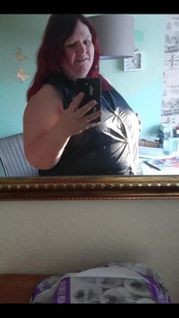 Showing off in a cool lab coat in front of the mirror