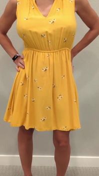 Stella in a Yellow Sun Dress with Black Heels